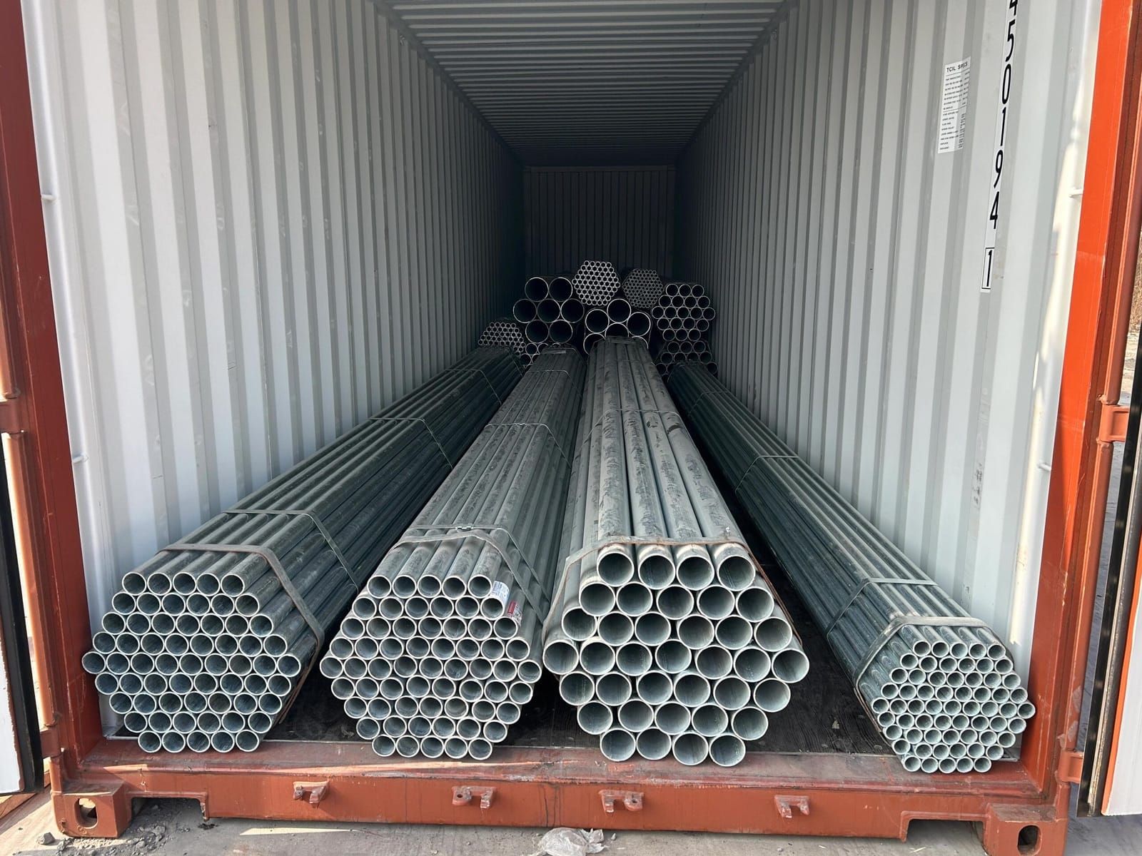 Full container loading view of bundled steel pipes for export from China